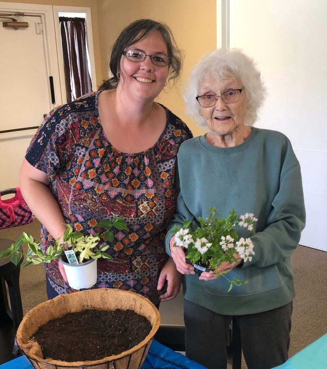 Montrose Health Center Two People Holding Flowers Indoors